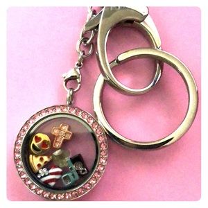 Origami Owl Keychain with charms in it
